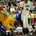 Ypsilanti senior Jalen Harmon attempts to save the ball in the game on Monday, March 4. Daniel Brenner I AnnArbor.com